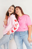 Buzo rosa corazones